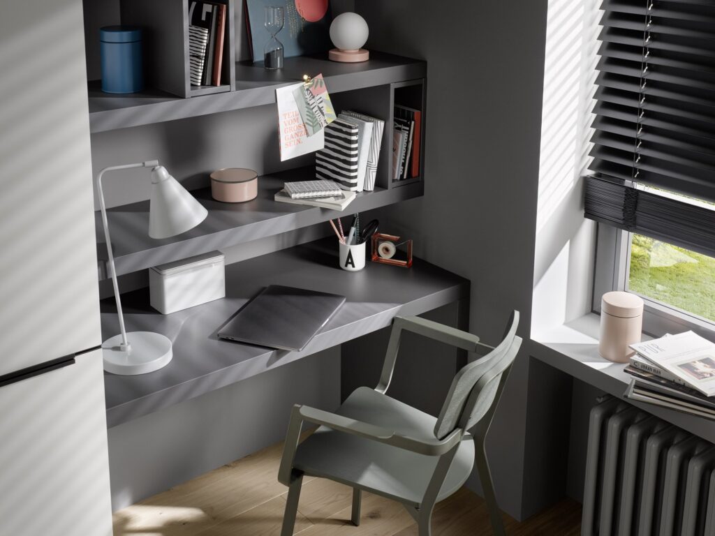 Modern home office with built-in desk and shelves