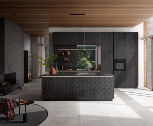Sleek dark-toned kitchen with textured cabinetry, central island and large window, reflecting reliable service and product quality