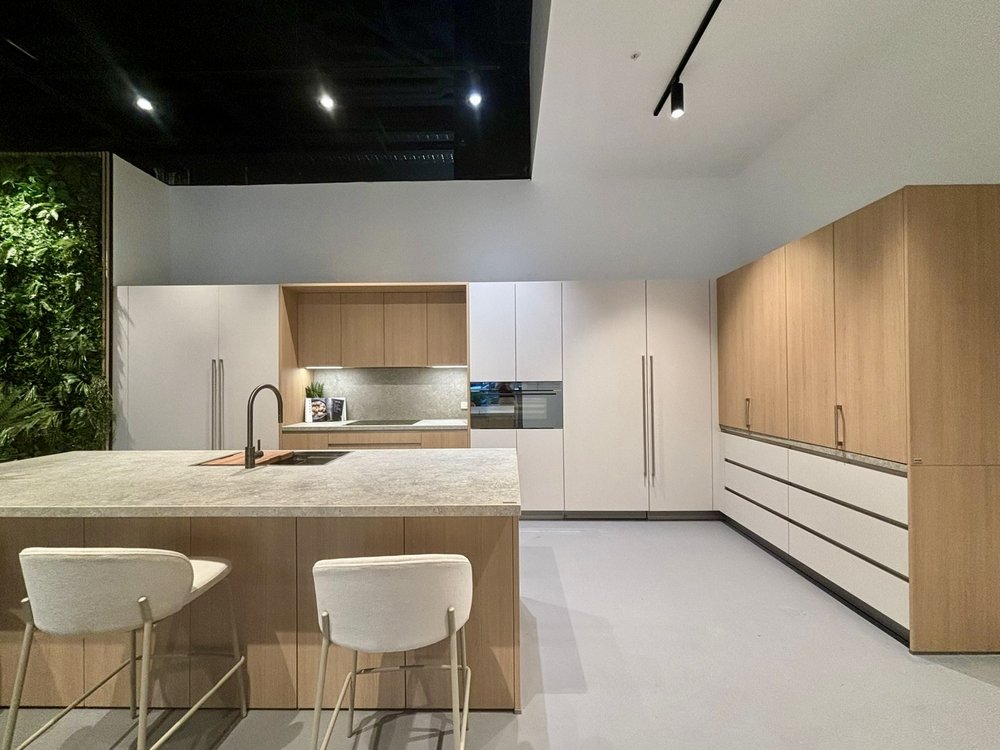 Modern L-shaped kitchen with island, timber and white cabinets