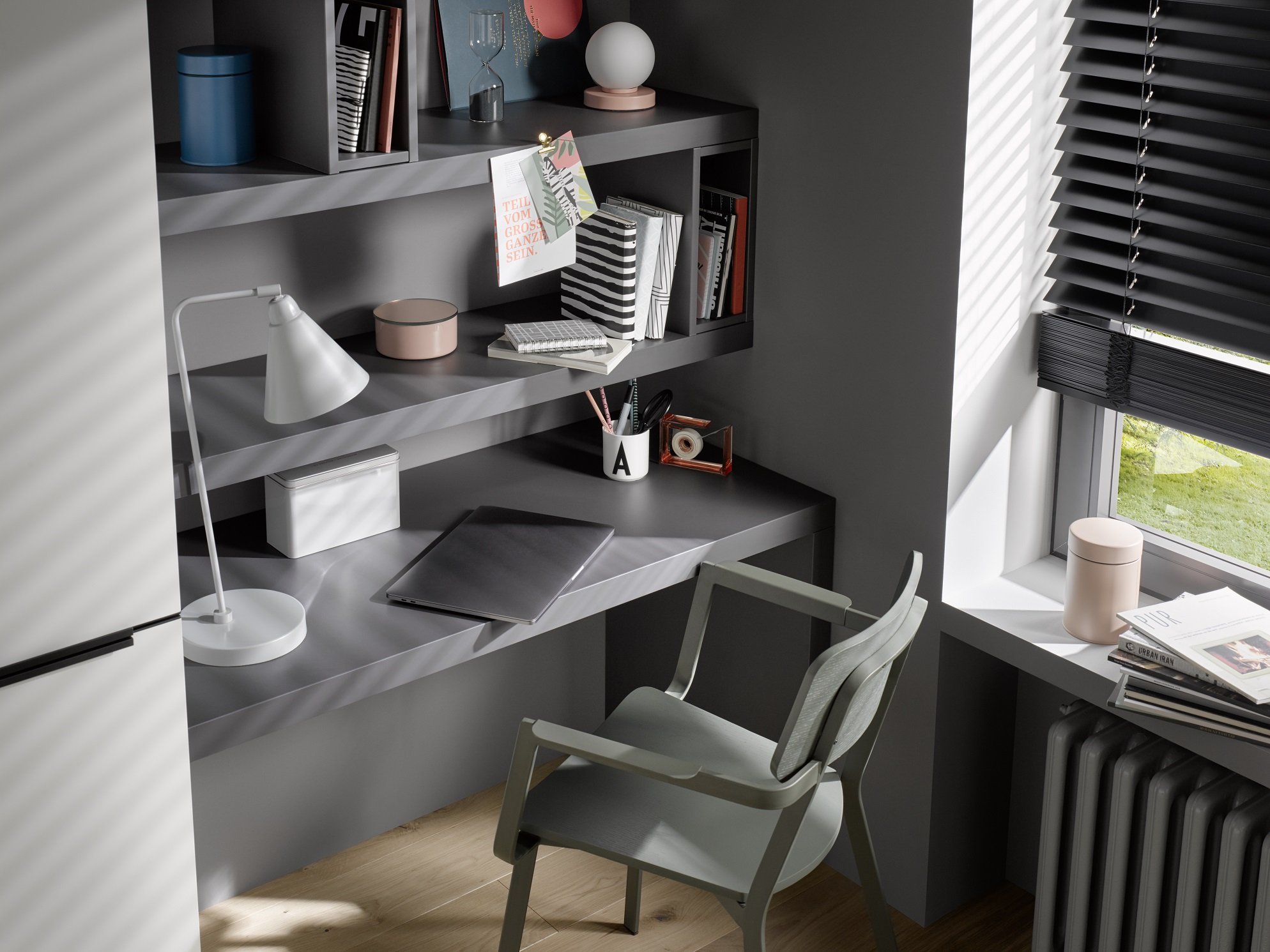 Modern home office with built-in desk and shelves